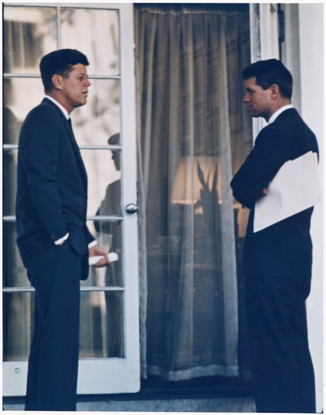 President Kennedy and Robert Kennedy standing facing each other