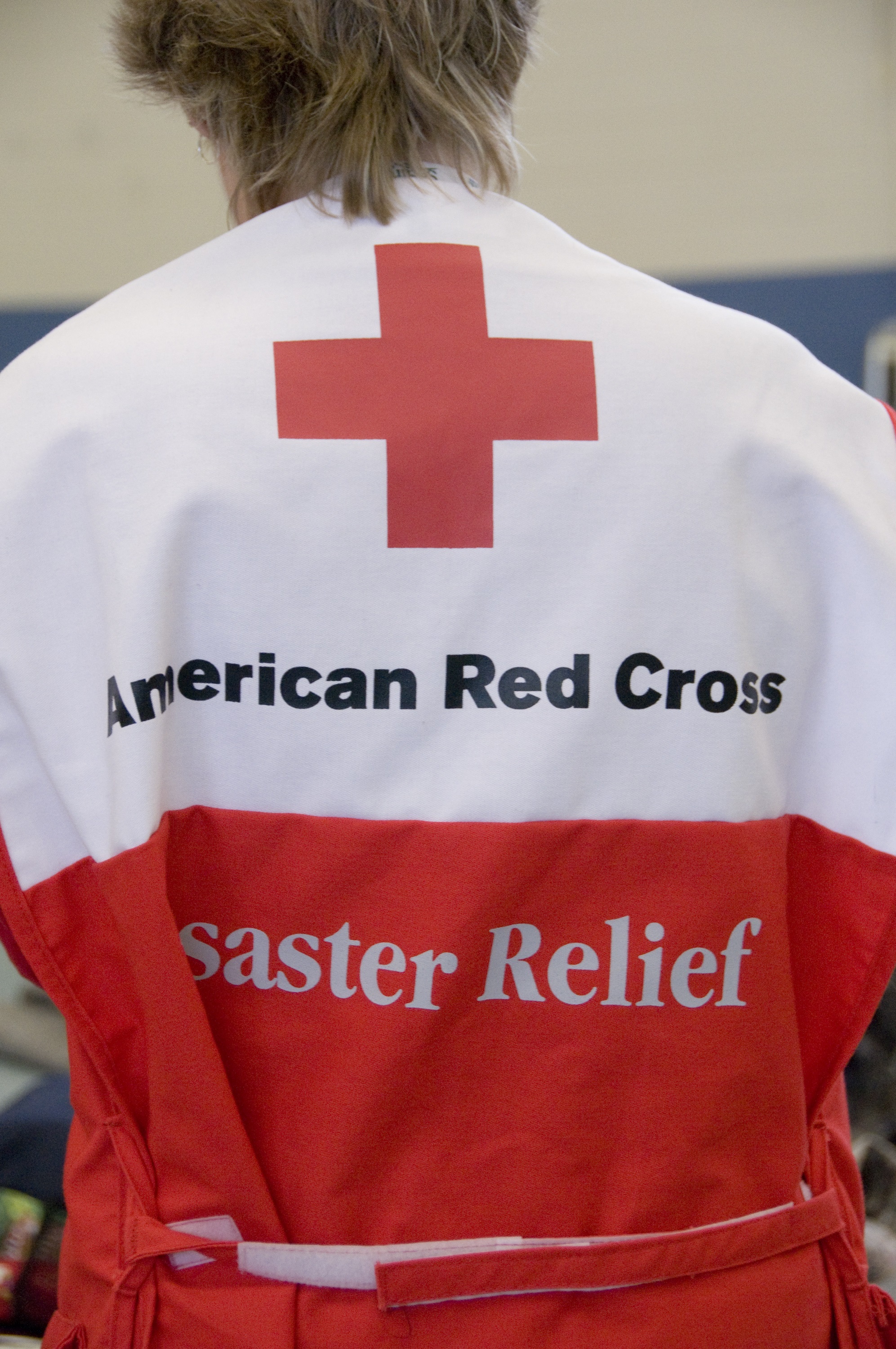 Image of aid worker with American Red Cross outfit.