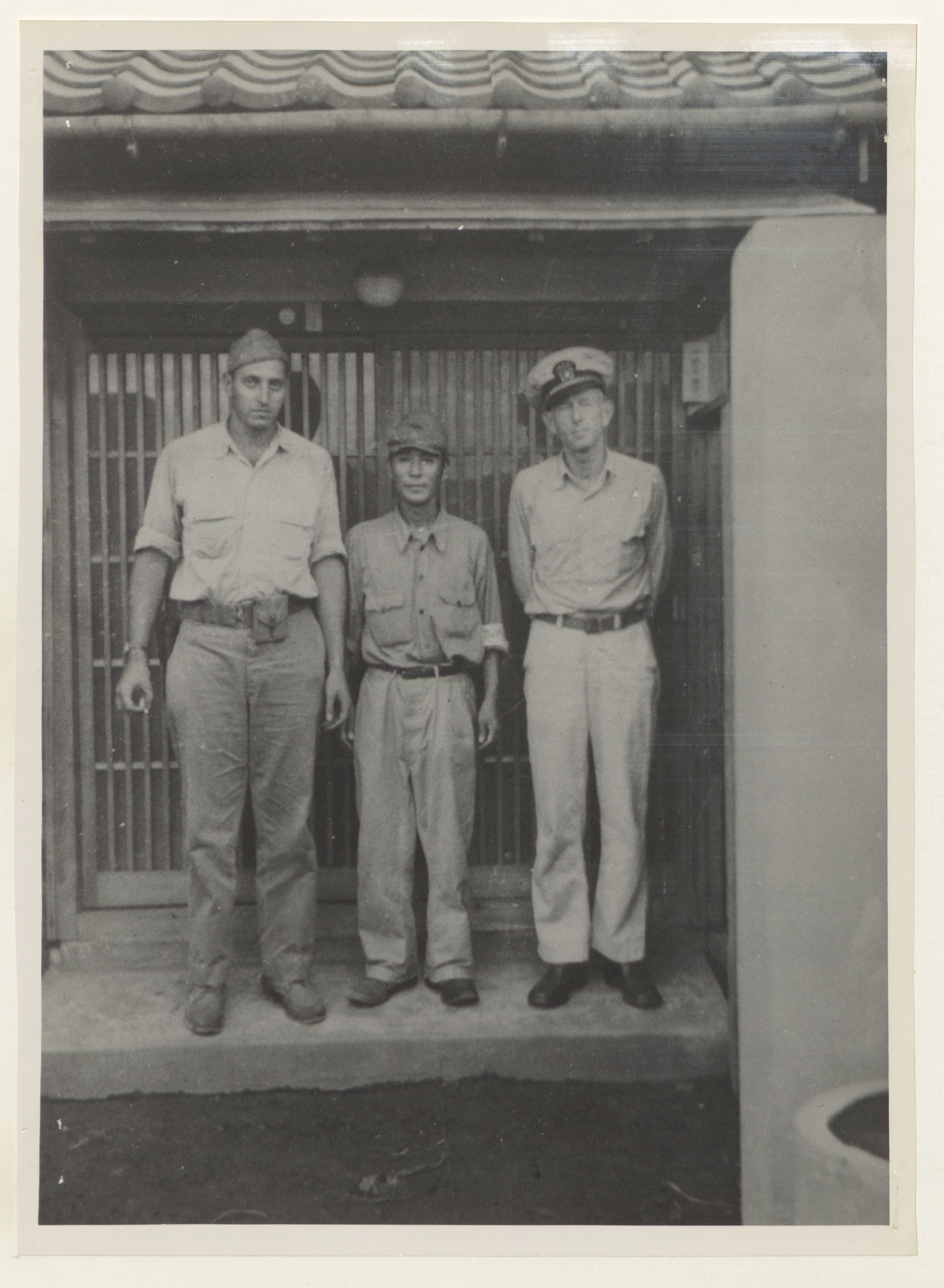 Image of Little, Yamauchi, and guard.