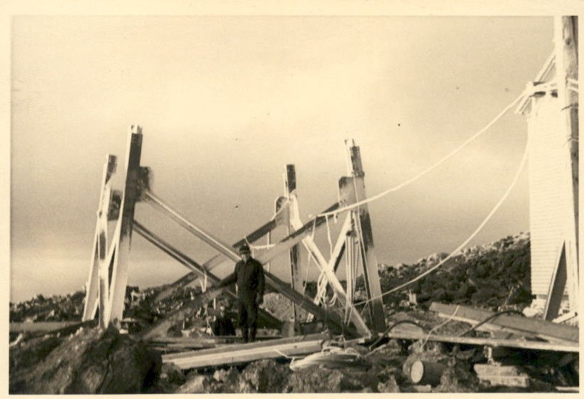 Image of Armstrong standing near a partially built tower.