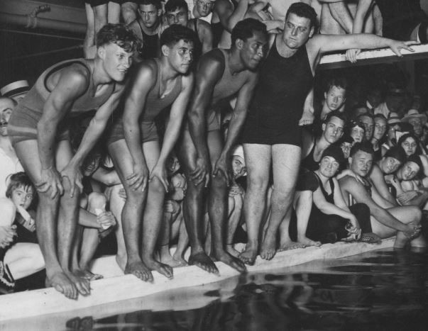 Image of swimmers at edge of pool.