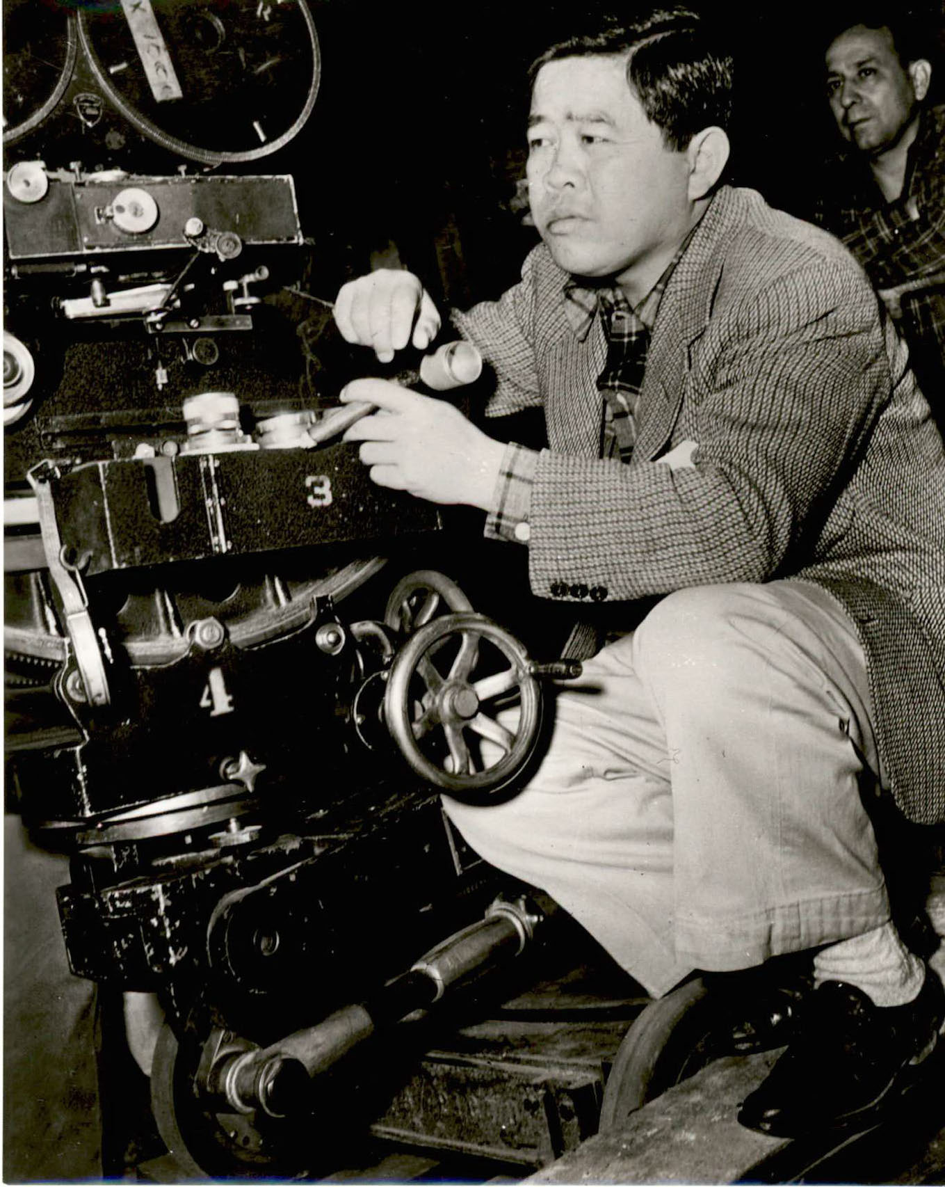 Image of James Wong Howe behind a camera